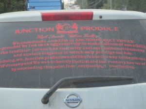 English gibberish on the back of a business vehicle.